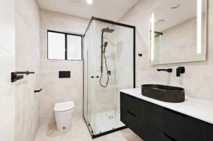 Modern bathroom with a glass shower and floating vanity