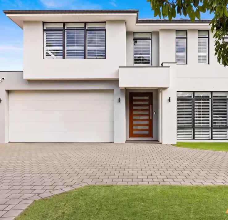 Completed double storey home with a paved driveway